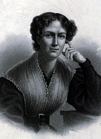 Photo of woman posed looking thoughtful, smiling